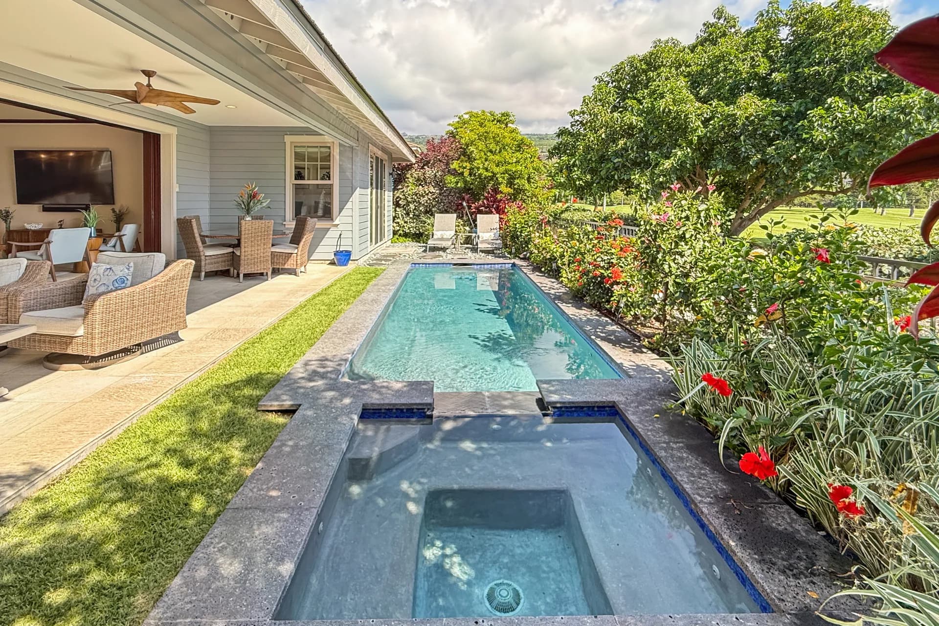 Island Time Keauhou — pool, lanai, and tropical landscaping